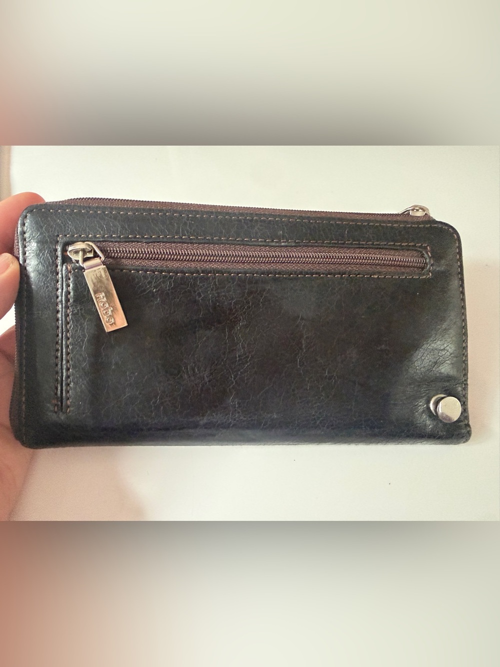 HOBO Black Leather Zip-Around Wallet with Exterior Zip Pocket, colorful interior